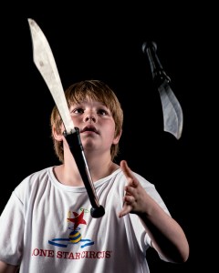 Knife juggling child